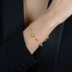 Pulseira Dourada com Pingentes de Coração e Esferas - Galeria